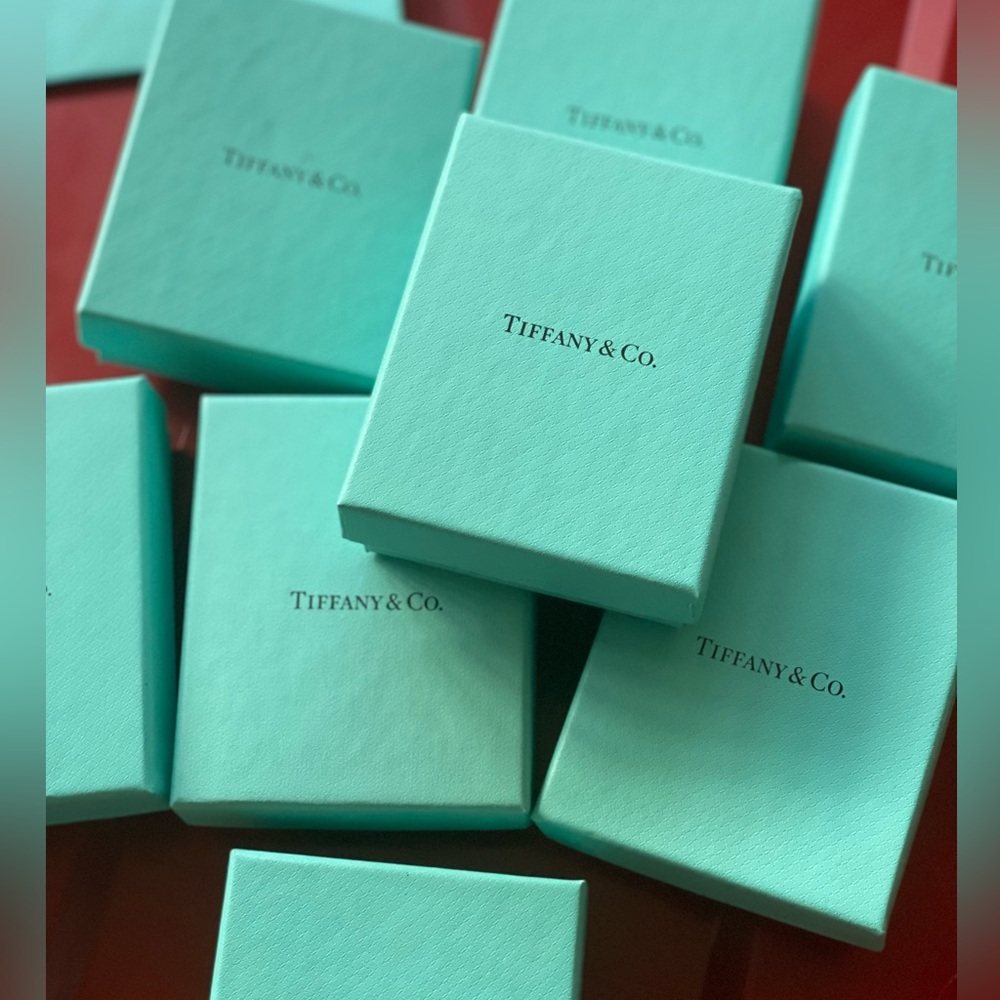 Tiffany & Co. original boxes with small bag.